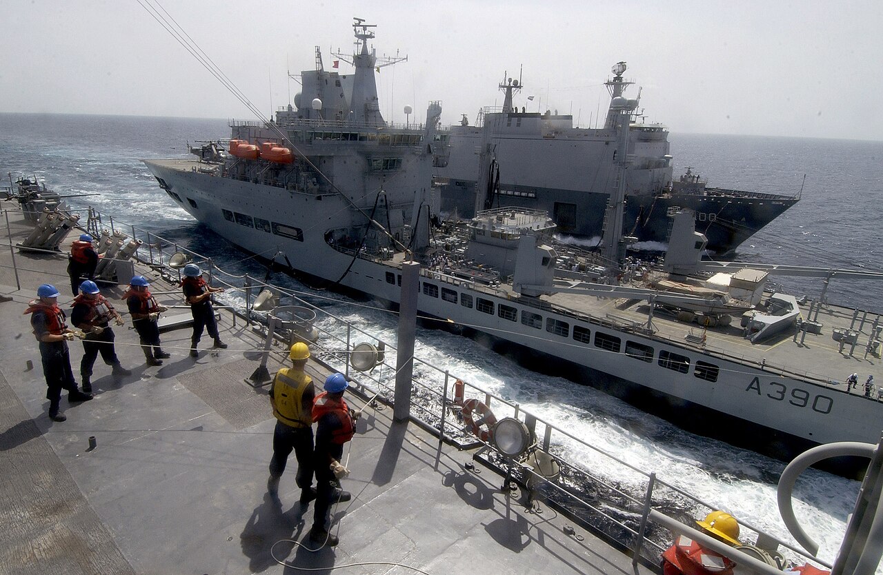US Navy 051103-F-5789F-110 Sailors aboard the dock landing ship USS Gunston Hall (LSD 44) hold on to a phone and distance line as it is connected to the British Royal Navy vessel HMS Wave Ruler