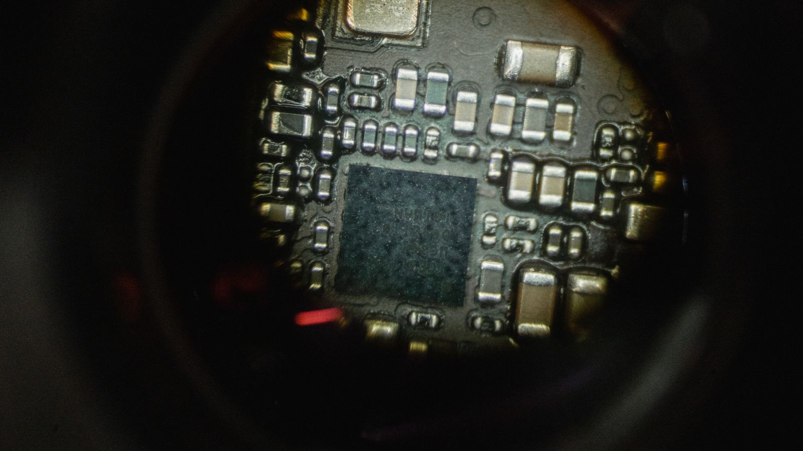Detailed macro shot of an electronic circuit board showcasing intricate components.