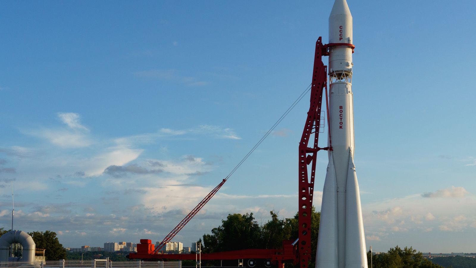 A large satellite dish with a clear blue sky in the background, showcasing modern communication technology.