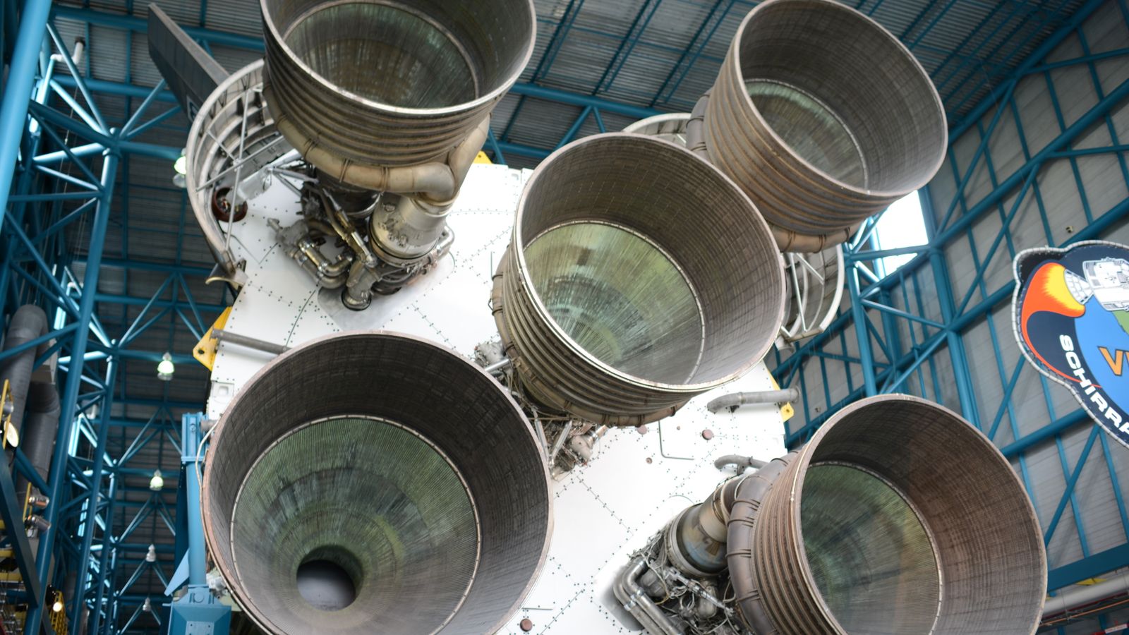 Close-up view of Saturn V rocket engines at Kennedy Space Center, highlighting intricate engineering.