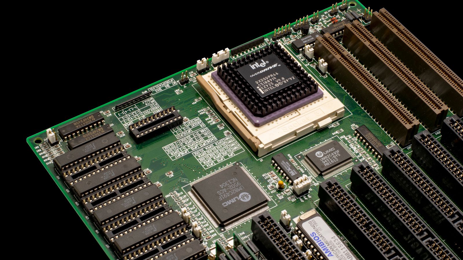 Detailed shot of a vintage motherboard showcasing microprocessor and electronic components.