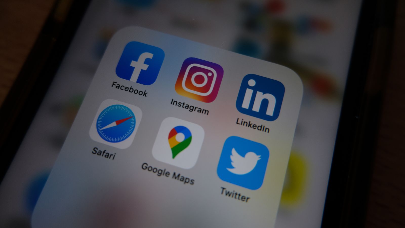 Close-up view of popular social media app icons on a smartphone screen.