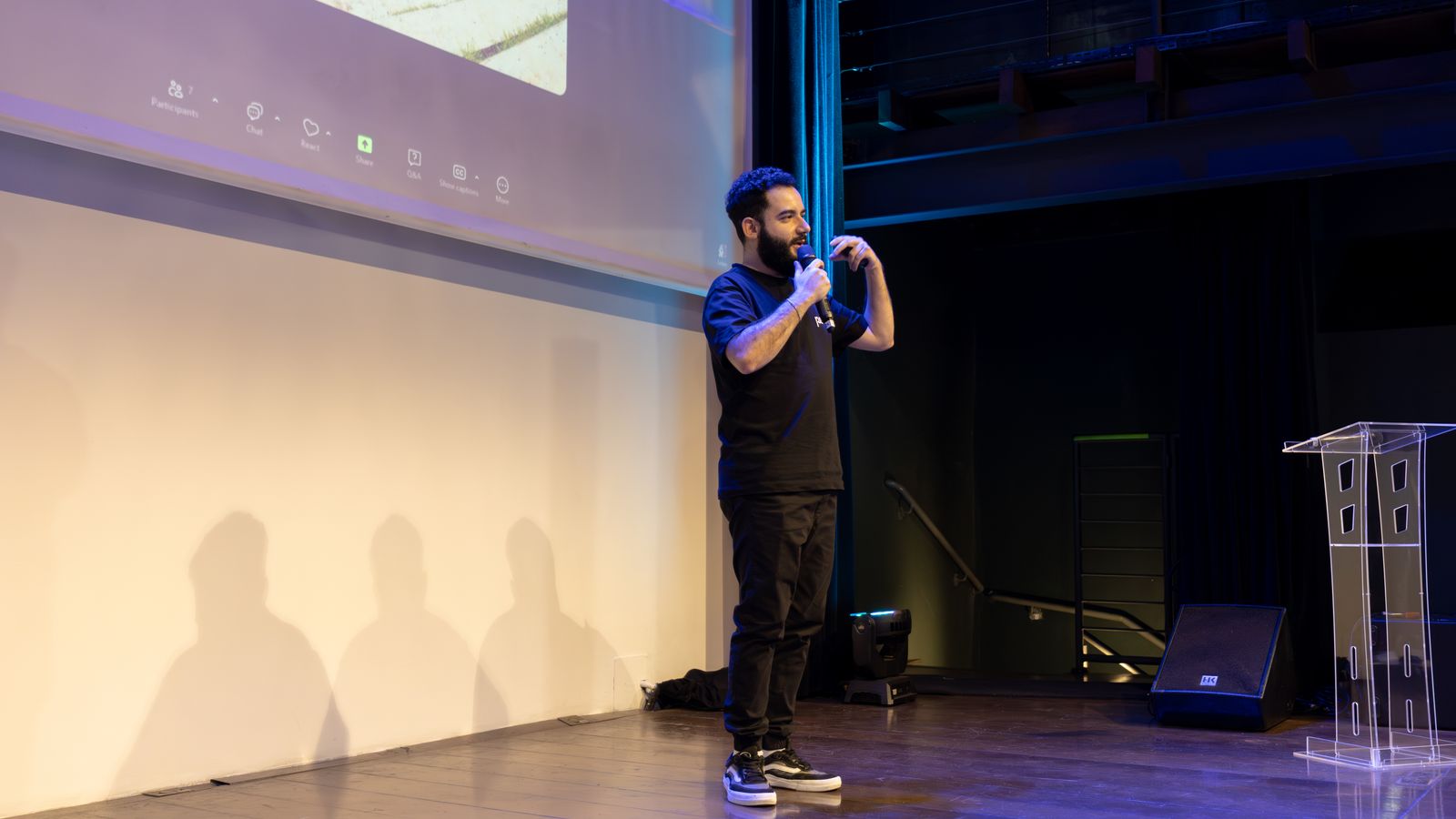 Energetic speaker delivering a talk at a corporate event
