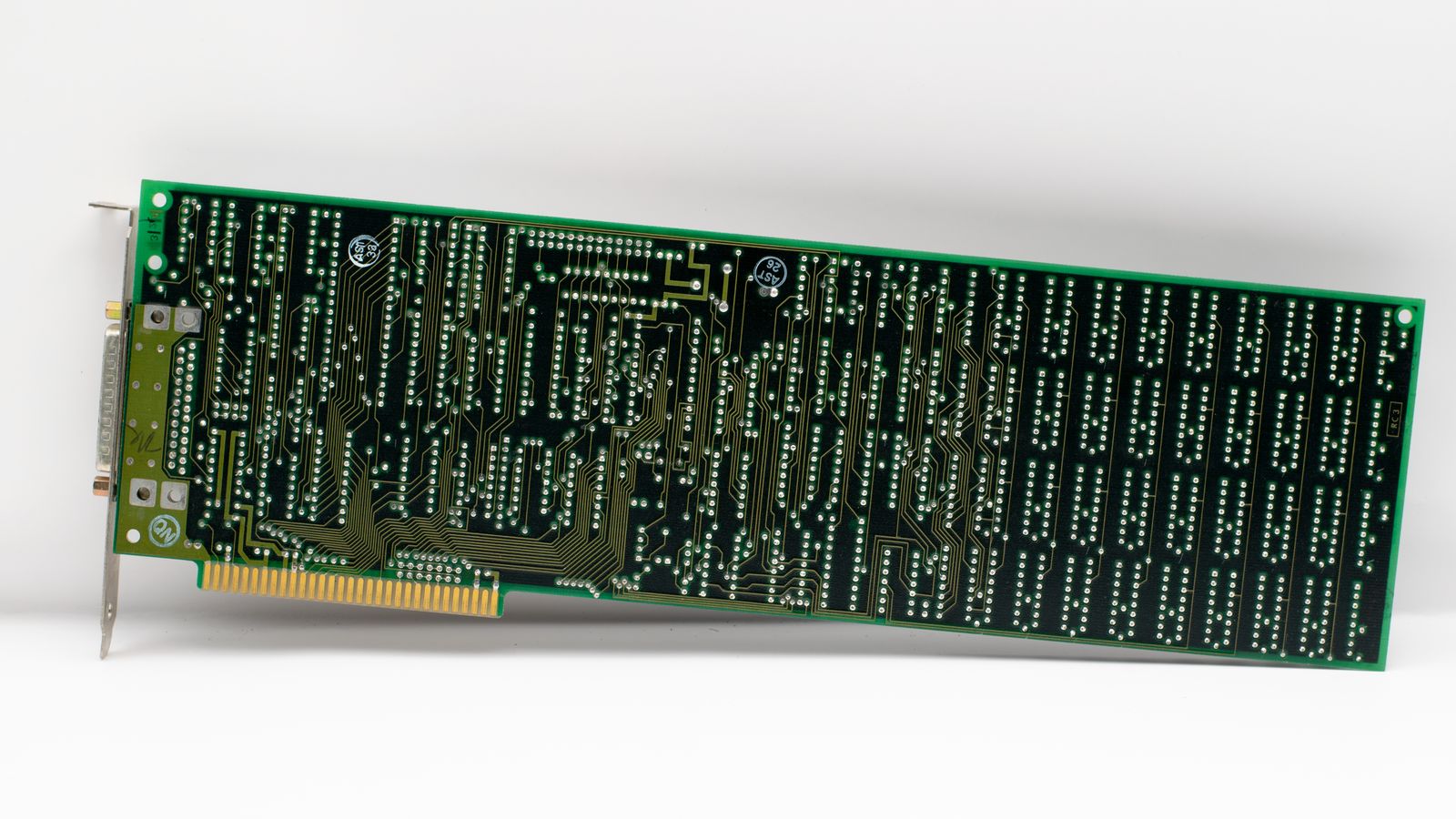 Close-up of a vintage electronic circuit board displaying intricate circuits and components.