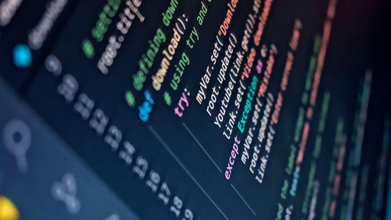 Close-up of a computer screen displaying colorful programming code with depth of field.