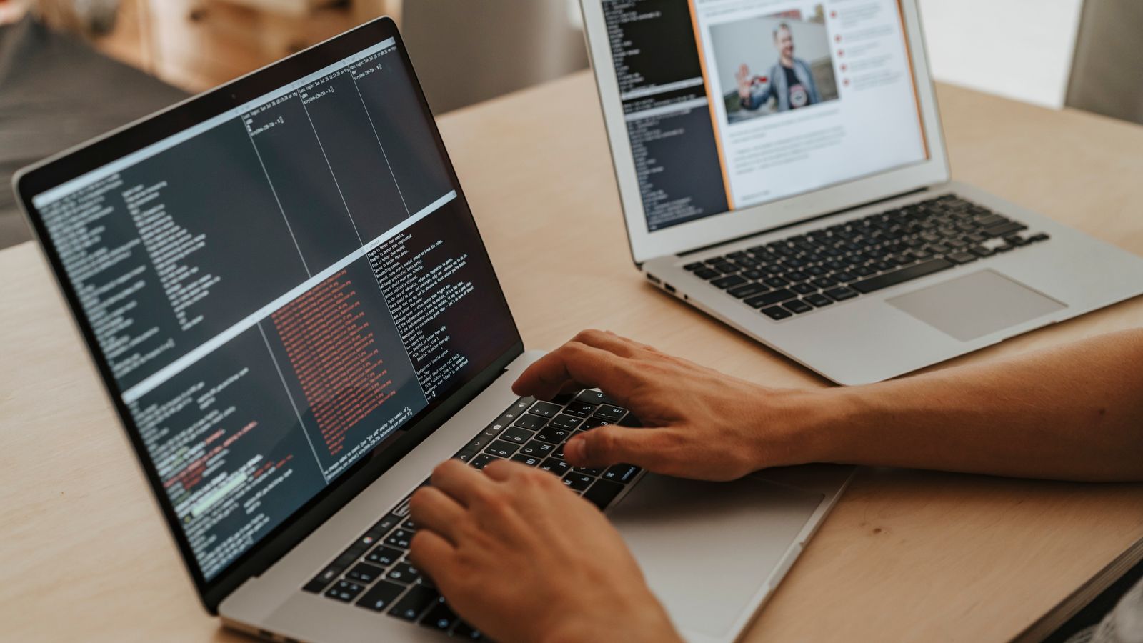 A developer working on a laptop, typing code, showcasing programming and technology skills.