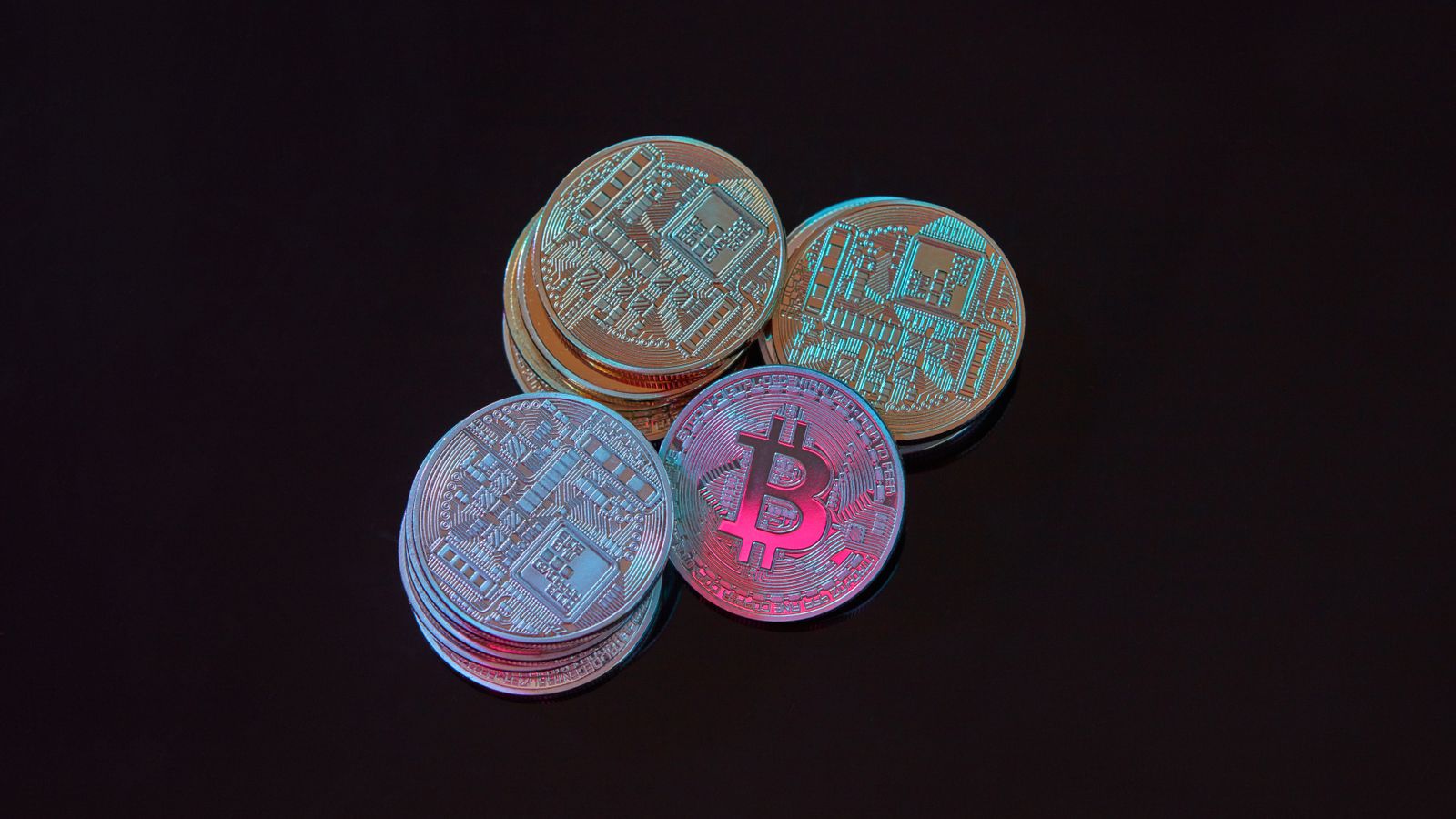 Digital coins with a stock market financial chart in the background, representing cryptocurrency trading.