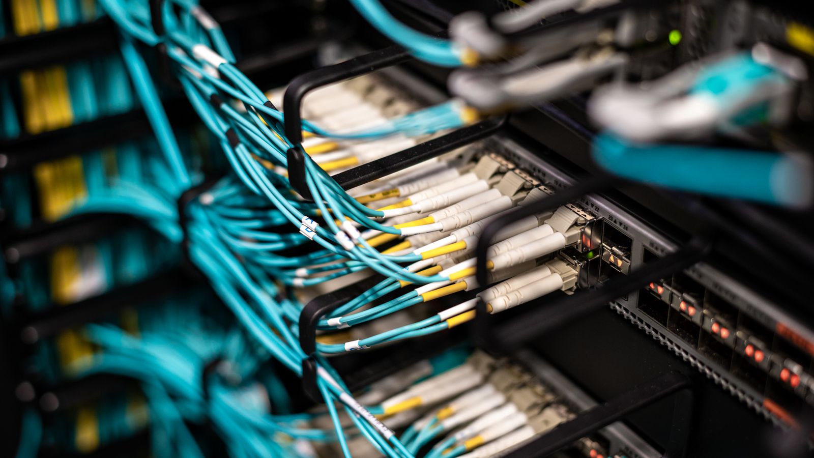Numerous wires and cables mounted into server patch panel in modern data center