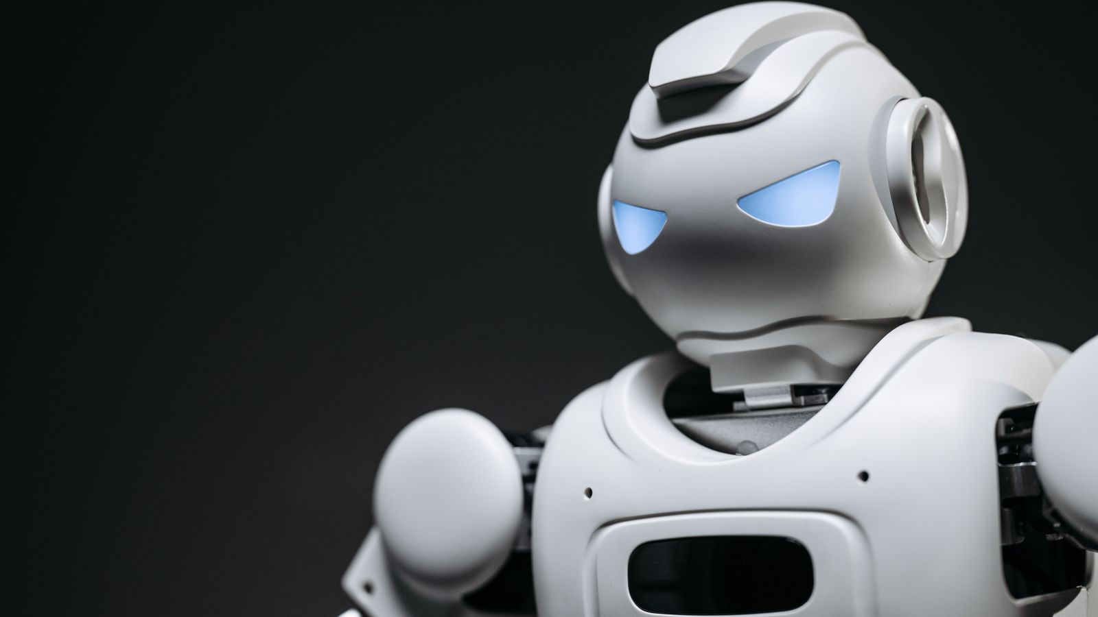 High-tech robot toy with a gray background in studio lighting.
