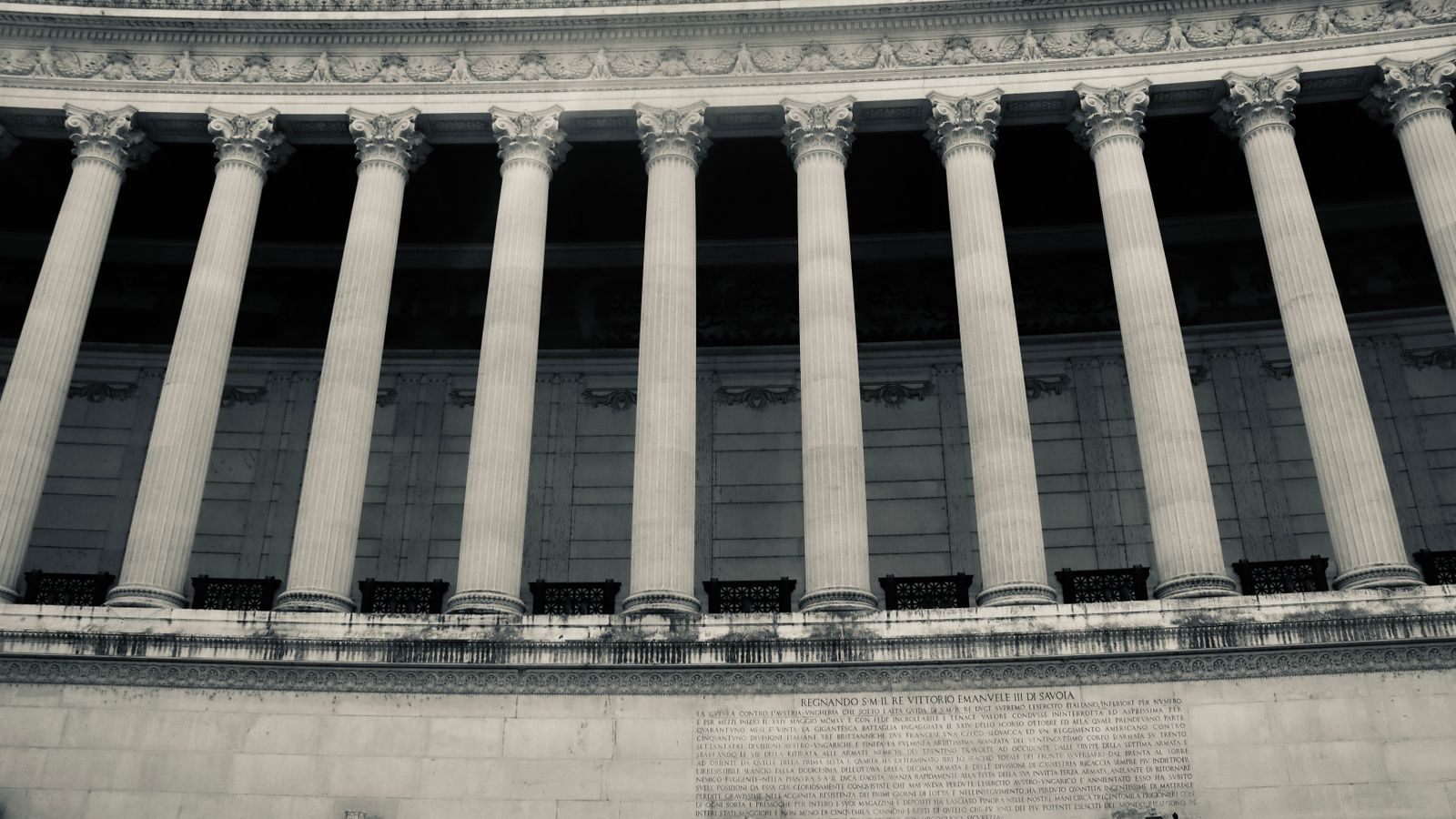 Detailed view of neoclassical columns in a government building facade.