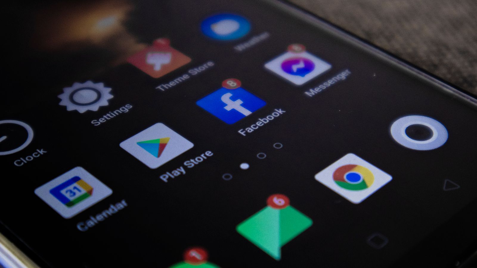 Detailed view of a smartphone screen with popular app icons including Facebook and Messenger.