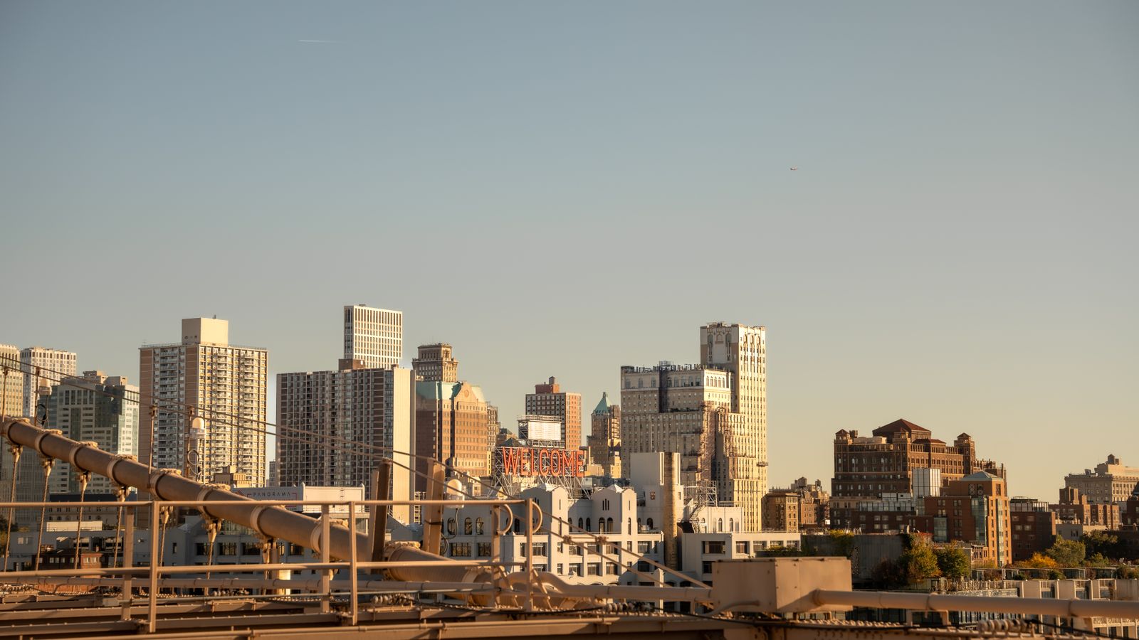Explore the iconic skyline of New York City captured from Brooklyn Bridge, showcasing urban architecture and vibrant city life.