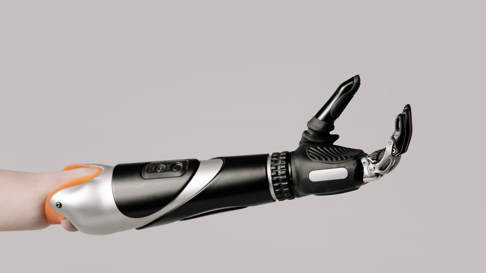 Close-up of a modern prosthetic arm displaying advanced technology and design.