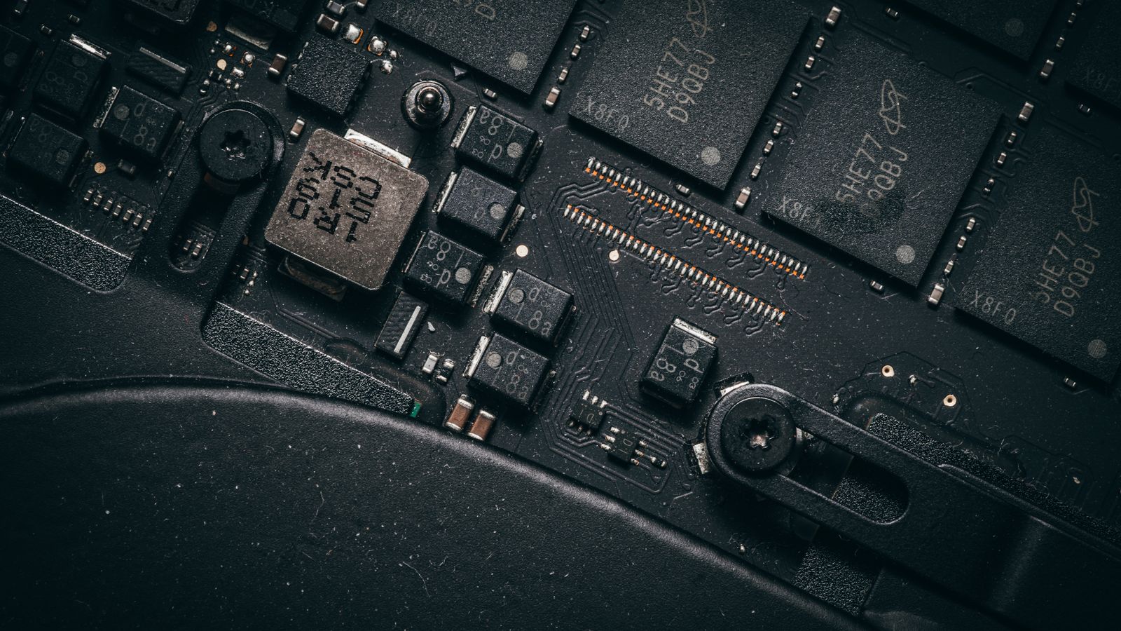 Detailed macro shot of electronic circuit board showing microchips and components.