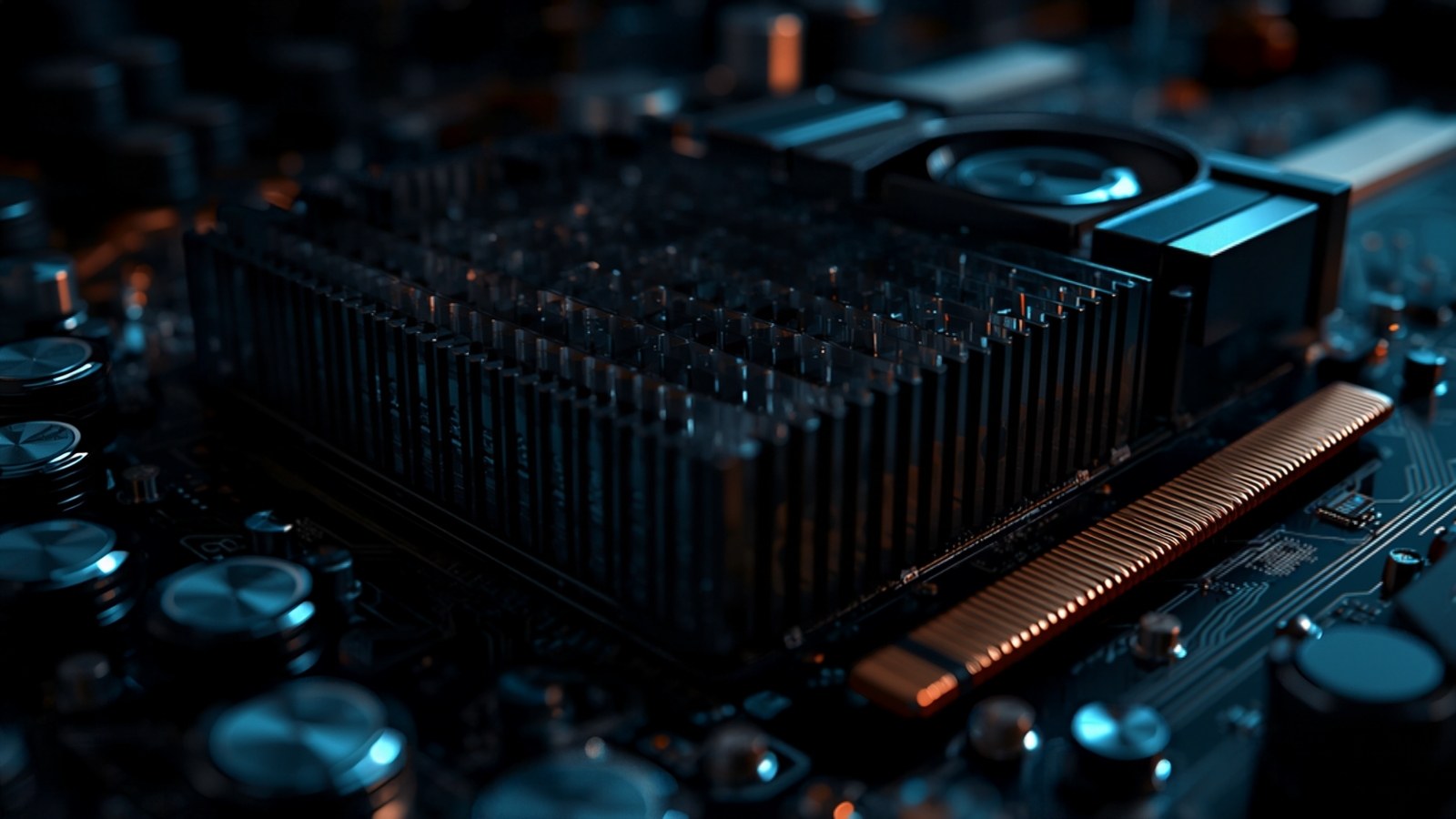 Close-up of an accelerator board with heatsink and capacitors in low light
