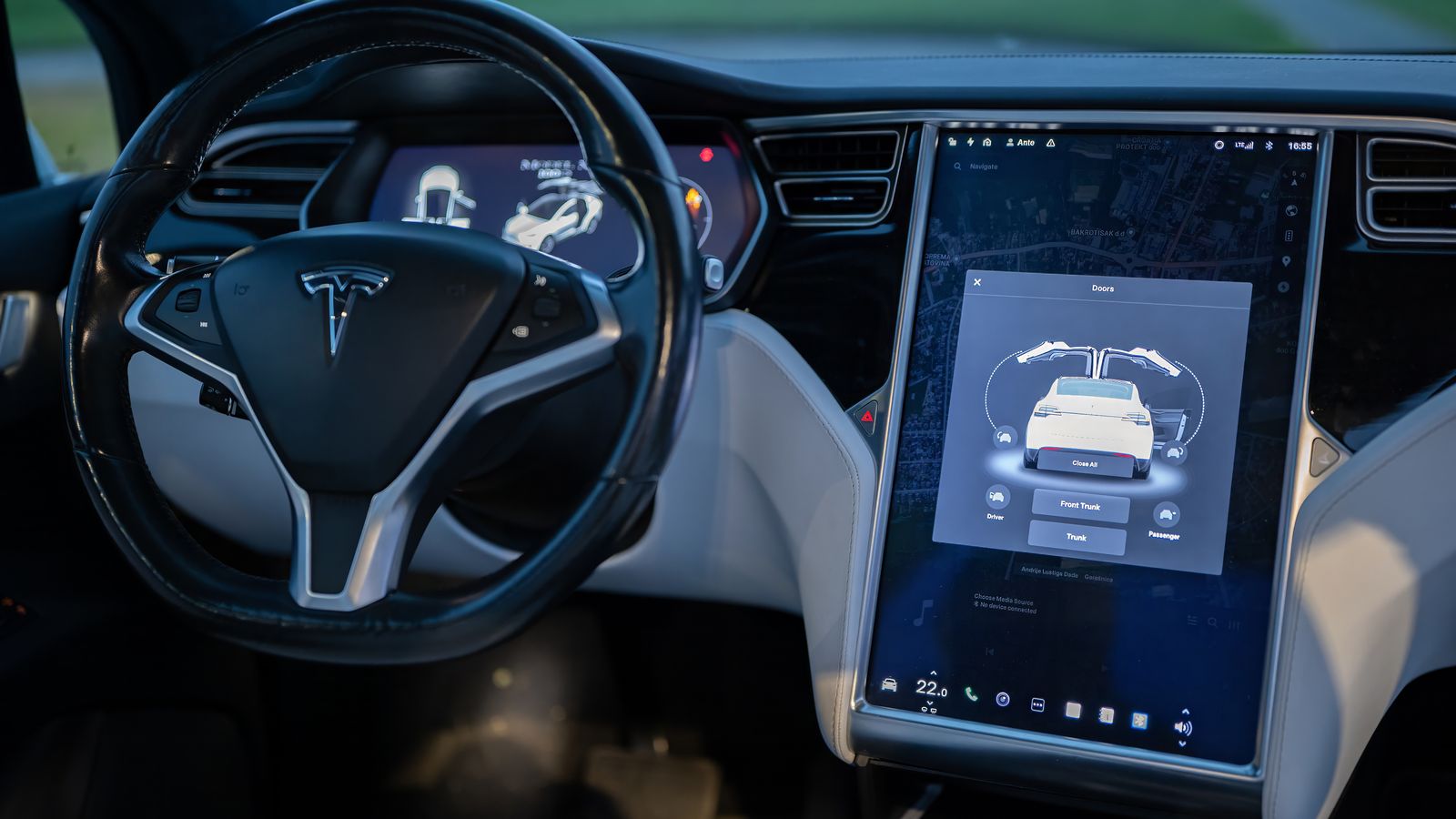 Interior shot of a modern electric car showcasing a sleek design and advanced touchscreen technology.