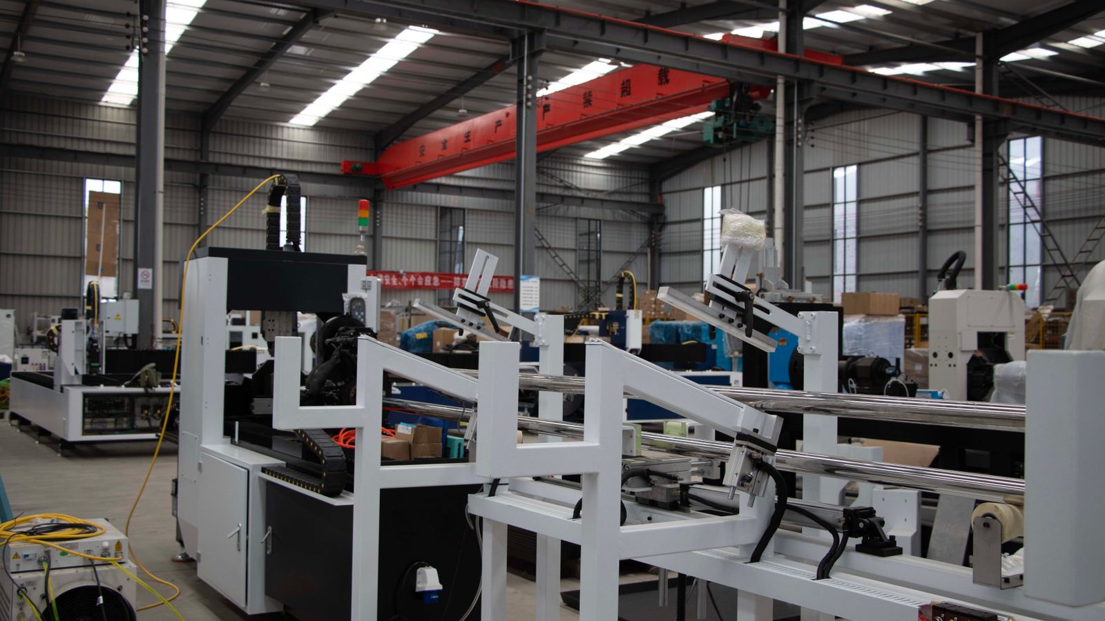 Interior view of a modern industrial manufacturing facility with machinery and equipment.