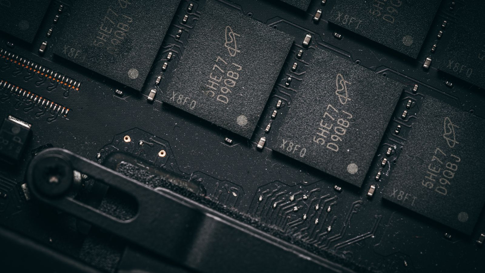 Dynamic close-up shot of illuminated gaming graphics card fans in red light, showcasing cutting-edge technology.