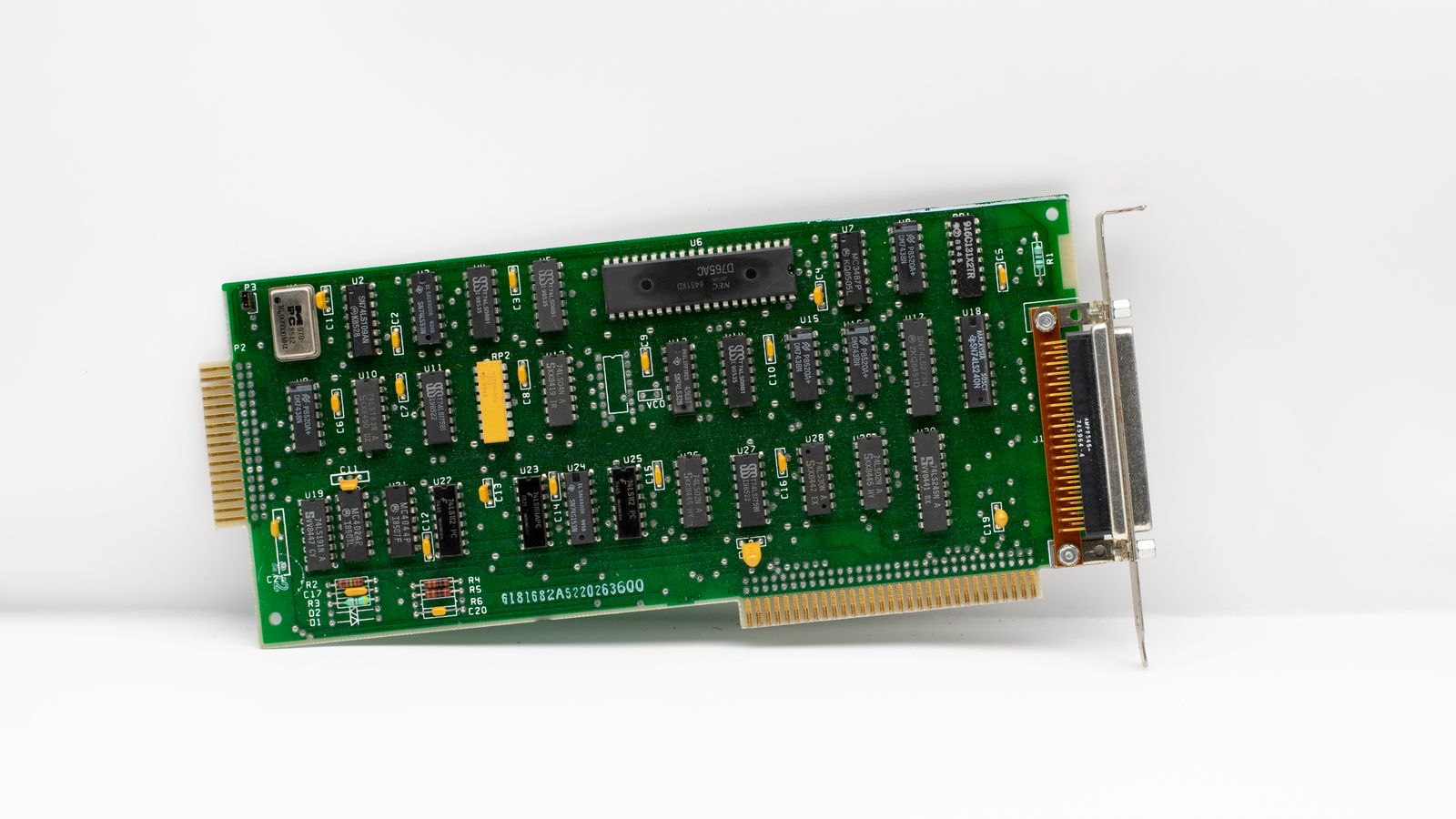 Explore a detailed vintage computer circuit board showcasing retro electronic components and chips.
