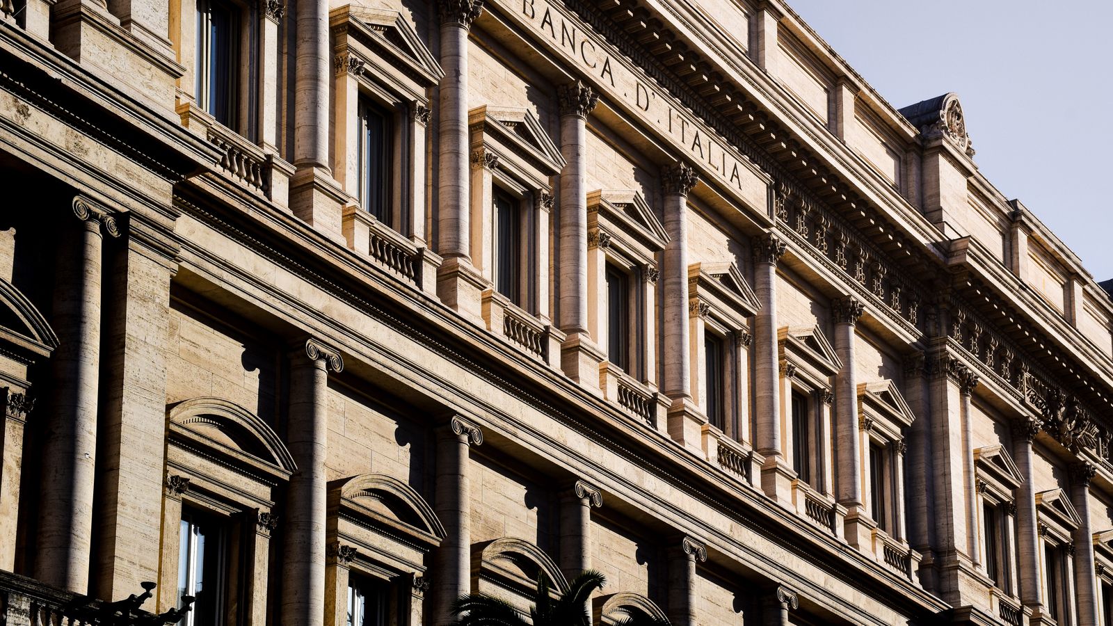 Sunlit facade of the iconic Banca d'Italia in Rome, showcasing classic architecture.