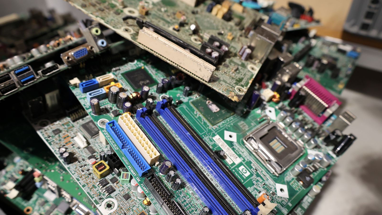Close-up of stacked circuit boards illustrating e-waste recycling and technology management.