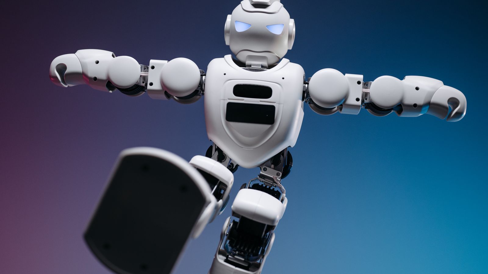 Close-up of a humanoid robot in motion, showcasing modern robotics innovation.