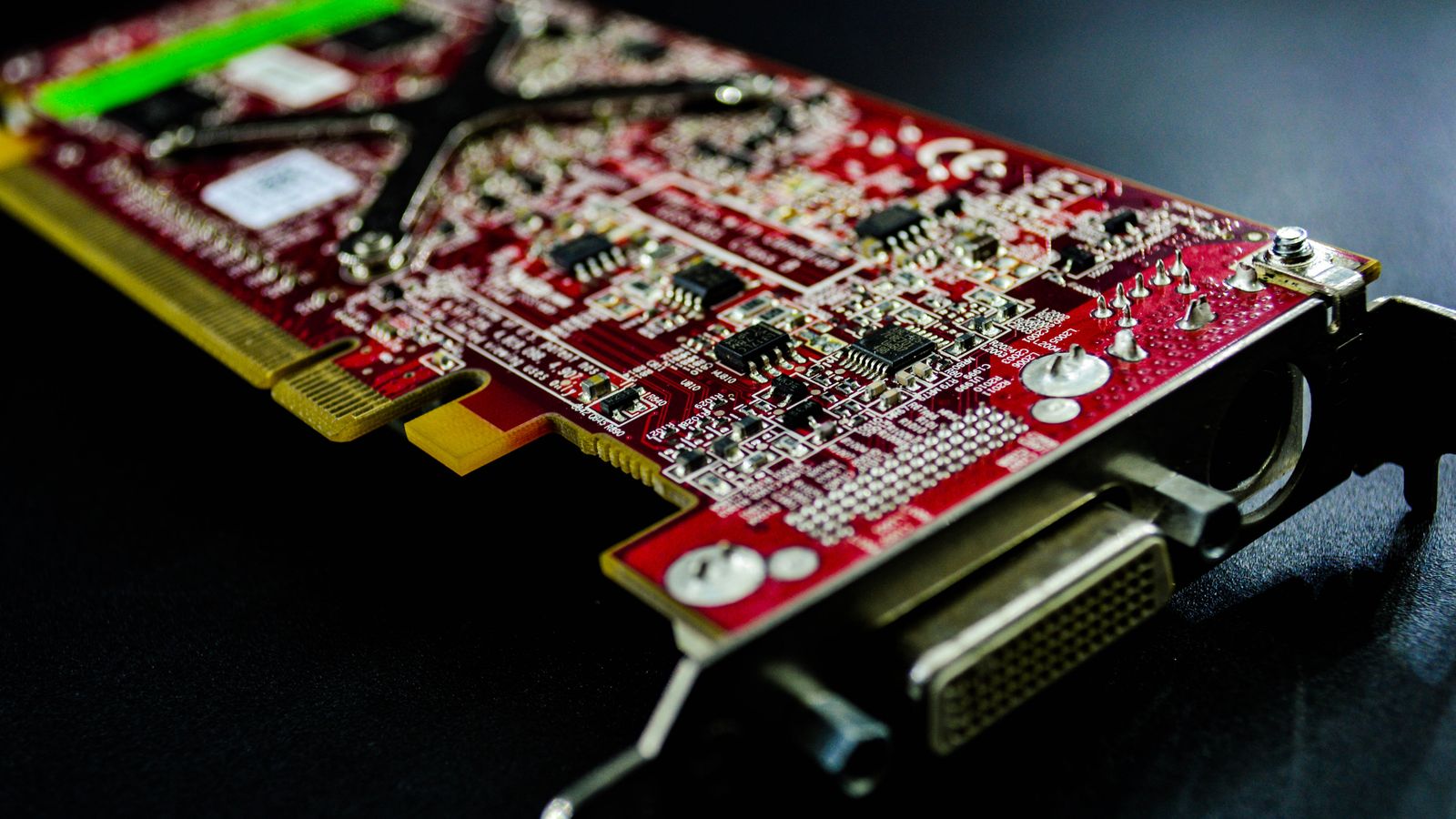 Detailed close-up of a red circuit board highlighting electronic components and connectors.
